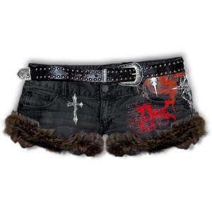 May include: Black denim shorts with a studded belt and a silver buckle. The shorts feature a silver cross on the front, red and white graphic designs, and brown faux fur trim along the bottom hem.