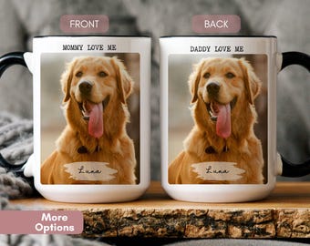 May include: White ceramic coffee mug with a black handle. The front of the mug has a photo of a golden retriever with the text "Mommy Love Me" and the dog's name "Luna". The back of the mug has a photo of the same dog with the text "Daddy Love Me" and the dog's name "Luna".