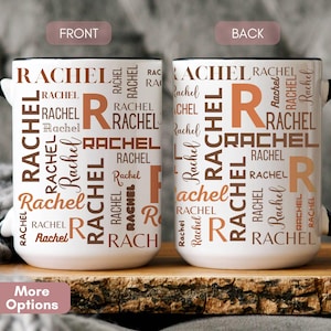 May include: Two white coffee mugs with black handles and rims. The mugs are personalized with the name "Rachel" in various fonts and shades of brown. The front and back of the mugs are visible.