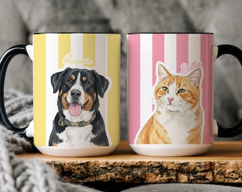 May include: Two ceramic mugs with black handles. One mug features a dog illustration with the name "Cooper" on a yellow striped background. The other mug has a cat illustration with the name "Bella" on a pink striped background.