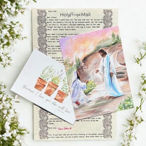 May include: A printed letter titled Holy Muse Mail with a decorative lace border, accompanied by two cards. One card features a watercolor painting of a figure kneeling before a standing figure in a garden. The other card shows three terracotta pots.