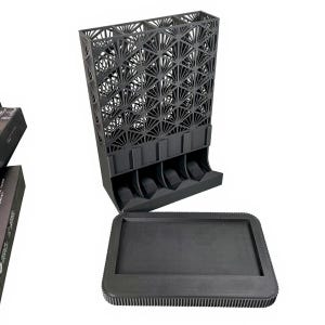 May include: A black, geometric, 3D-printed organizer with a decorative fan-like pattern. The organizer has multiple slots and a separate tray. The design is modern and functional, suitable for storing small items.