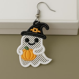 May include: Embroidered Halloween ghost earring with a black witch hat and an orange pumpkin. The ghost is white with black eyes and a smiling mouth. The earring has a silver fish hook.