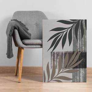Arte mural botánico minimalista, impresión en lienzo de hojas en verde neutro y beige, decoración moderna inspirada en la naturaleza para sala de estar u oficina.