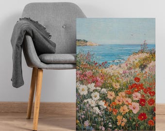 Puede incluir: Pintura al óleo de una escena costera con flores coloridas. Las flores, en tonos de rojo, rosa, blanco y naranja, conducen a una vista del océano azul y el cielo. Una silla gris con una manta está en el fondo.