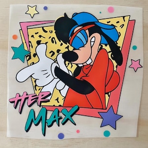 May include: A vibrant graphic of Max from A Goofy Movie. Max is depicted in a red hoodie, blue cap, and sunglasses, giving a thumbs up with a white gloved hand. The words "HEP MAX" are in a retro style, with stars and shapes surrounding the character.
