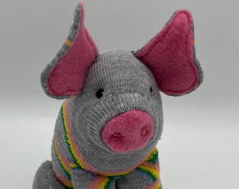 ROY G BIV a Rainbow Pig, symbol of Good Luck, Pride, Hope and Dreams. He's a happy little hog, truly a treasure at the end of a Rainbow.