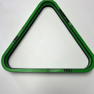 May include: Green and black 9-ball and straight pool triangle rack. The triangle is green with black stripes and text that reads "9 BALL" and "STRAIGHT POOL". The rack is used to set up billiard balls.