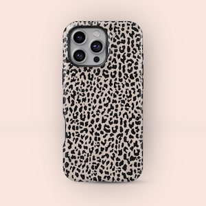May include: A smartphone case with a leopard print design. The case has a beige background with black spots, and a black border. The camera lenses are visible at the top. The case is designed to protect the phone.