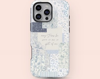 May include: A phone case with a floral patchwork design in shades of blue and white. The case features a camera cutout and the text "may Jesus be seen in me in spite of me" in a handwritten font.