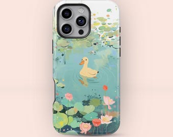 May include: A phone case featuring a serene pond scene with a yellow duckling swimming in the water. The design includes lily pads, pink flowers, and a soft, watercolor-like aesthetic. The case is designed to fit a smartphone.