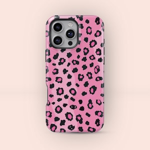 May include: A pink phone case featuring a black and pink leopard print pattern. The case has a glossy finish and a camera aperture. Designed to fit a smartphone.