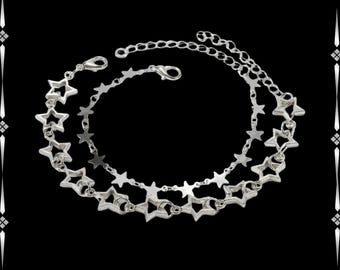 Conjunto de pulseras de cadena con estrellas punk grunge: joyería vanguardista con capas de plata