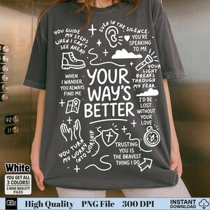 Puede incluir: Camiseta gris oscuro con texto gráfico e ilustraciones en blanco. El diseño incluye frases como "Your Way's Better" y "Trusting You Is The Bravest Thing I Do". La camiseta también presenta un mapa, una brújula y otros símbolos religiosos.