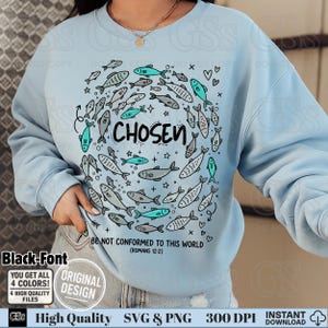 May include: Light blue sweatshirt with a circular design of fish in shades of gray and teal, surrounding the word "CHOSEN". The text "BE NOT CONFORMED TO THIS WORLD (ROMANS 12:2)" is below the word "CHOSEN".