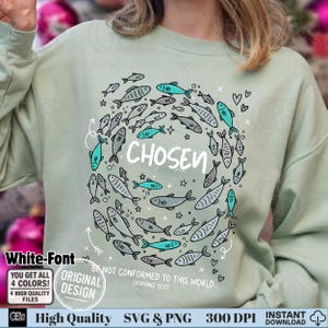 May include: A light green sweatshirt with a circular design of fish in shades of gray and teal, surrounding the word "CHOSEN". The text "BE NOT CONFORMED TO THIS WORLD (ROMANS 12:2)" is also included. The design is a high-quality SVG and PNG file.