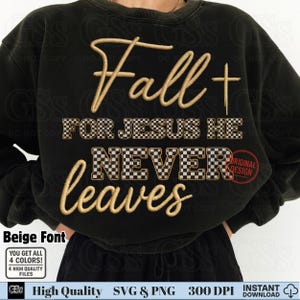 May include: Black sweatshirt with the text "Fall for Jesus He Never Leaves" in beige script and checkered font. A cross is next to the word "Fall". The words "Original Design" are in a red circle.