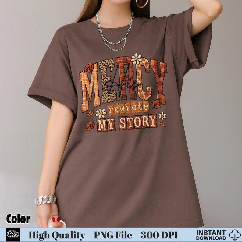 Woman in brown tee with fall Christian quote “Mercy His Rewrote My Story” patch design
