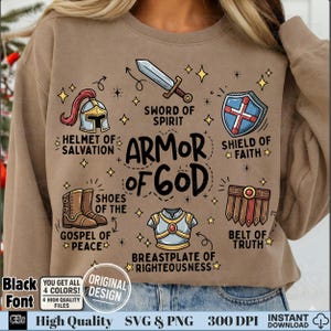 Black font Armor of God design with colorful doodle icons like sword and shield on sand sweatshirt.