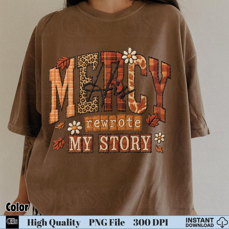 Brown shirt with bold patchwork letters “Mercy His Rewrote My Story” fall style