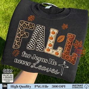 May include: Black sweatshirt with the word "FALL" in a mix of leopard print, checkered, and pumpkin-themed designs. The text "for Jesus He never Leaves" and a cross are below the word "FALL".
