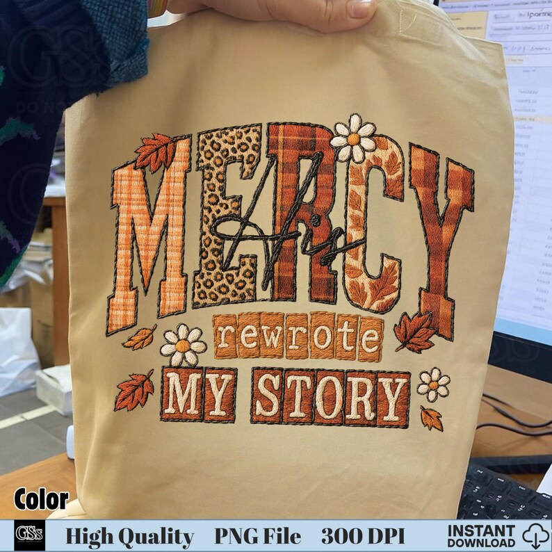 Beige tote bag mockup with “Mercy His Rewrote My Story” sublimation clipart