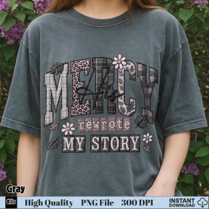 Woman wearing gray t-shirt with “Mercy His Rewrote My Story” Christian PNG