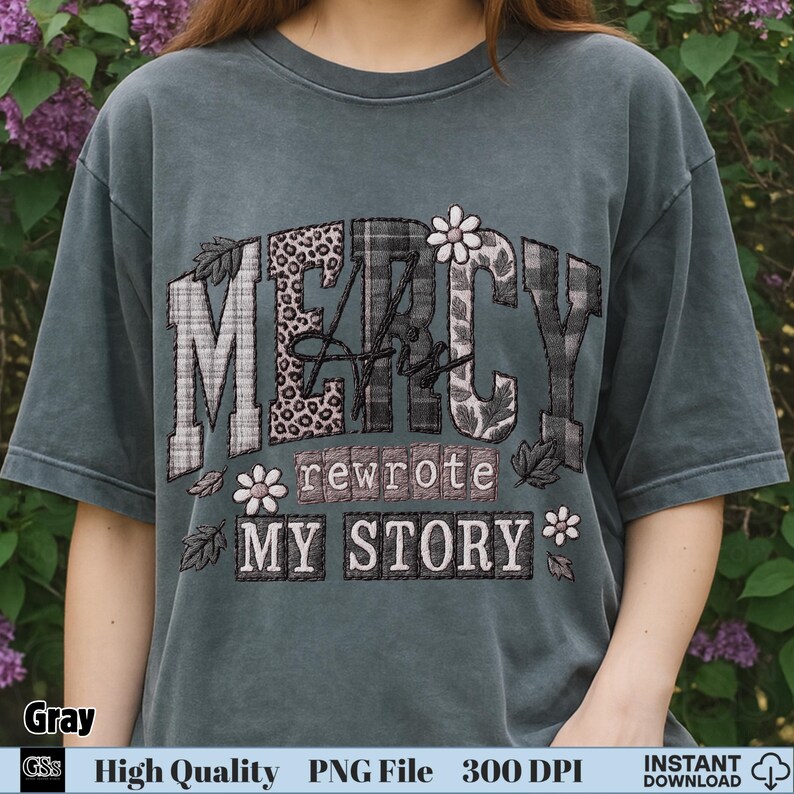 Woman wearing gray t-shirt with “Mercy His Rewrote My Story” Christian PNG