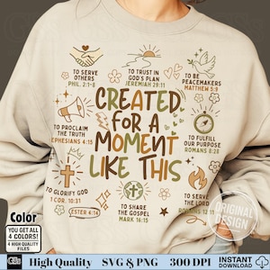 May include: Beige sweatshirt with the phrase "CREATED FOR A MOMENT LIKE THIS" in brown and green, along with various religious symbols and Bible verses. The design includes a cross, dove, and other graphics.