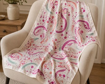May include: A square scarf featuring a white background with a repeating pattern of magenta paisley swirls, small pink and orange floral motifs, and soft teal fern-like sprigs. The scarf has a solid cream-colored border along all four edges.