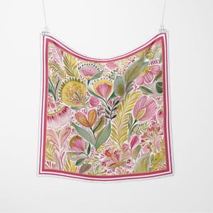 May include: A square scarf with a floral design. The scarf has a white background with a pattern of pink, yellow, and green flowers and leaves. A pink border with white stripes surrounds the floral pattern.