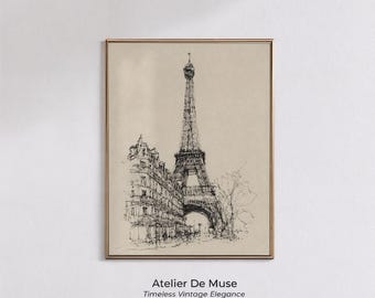 May include: A framed print featuring a pen and ink illustration of the Eiffel Tower and a Parisian building. The artwork is in a gold frame and has a beige background. The text "Atelier De Muse Timeless Vintage Elegance" is at the bottom.