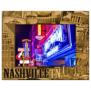 May include: Wooden framed art print featuring a vibrant nighttime scene of Nashville, TN, with neon signs and the city's name at the bottom. The frame has a collage of architectural and city elements.
