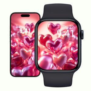 Op de afbeelding: Een zwarte smartwatch en smartphone tonen een achtergrond met harten met zwevende roze en rode harten. De schermen tonen de datum, donderdag 22 augustus, en de tijd, 9:41 uur.
