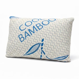 May include: Rectangular pillow with a cream-colored background and a blue geometric pattern. The words "COOL BAMBOO" are printed diagonally in blue. Blue leaf designs are also present on the pillow.