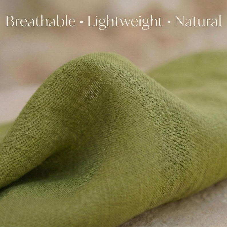 May include: Close-up of a folded, light green fabric. The fabric has a textured weave and appears to be lightweight. The words "Breathable &bull; Lightweight &bull; Natural" are printed at the top of the image.