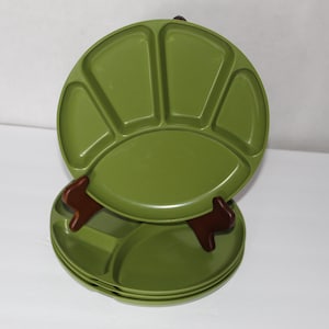 May include: A white ceramic mug with a black handle and the text "But First, Coffee" in a black, bold font. The mug is on a white surface.