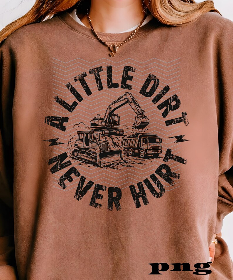 May include: Brown sweatshirt with a graphic design featuring construction vehicles: a bulldozer, excavator, and dump truck. The text "A LITTLE DIRT NEVER HURT" is printed in a distressed font, creating a vintage look.