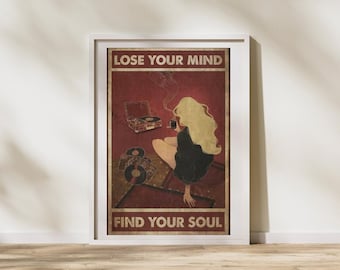 May include: Framed poster with the text "LOSE YOUR MIND" at the top and "FIND YOUR SOUL" at the bottom. The poster features a woman with long blonde hair, a record player, and vinyl records on a red background.