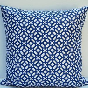 May include: A blue and white geometric patterned throw pillow. The pillow is square and has a white background with a blue geometric pattern.