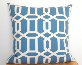 May include: Square throw pillow with a geometric pattern in light blue and off-white. The pillow features a repeating design of interlocking shapes, creating a modern and stylish look. The pillow is made of a soft fabric and is suitable for home decor.