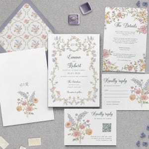 May include: A wedding invitation suite featuring floral designs in pastel colors. The invitation includes the names "Emma and Robert" and the date "05.04.2026". The suite includes an envelope, invitation, details card, and reply cards.