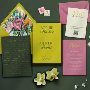 May include: Wedding invitation suite with a floral envelope liner, invitation, RSVP card, and details card. The invitation features the names Sophie Marlow and Oliver Bennet. The suite includes stamps and orchids.