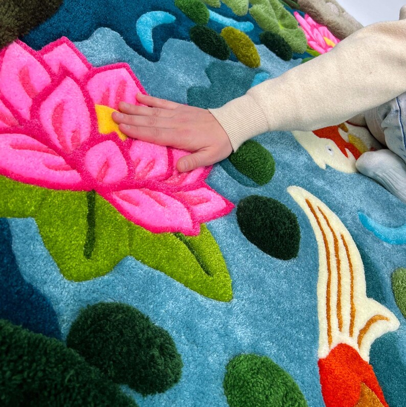 Oversized hand tufted koi pond area rug with layered 3D texture, inspired by Japanese garden and nature
