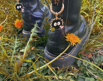 Whimsical Black Fuzzy Boot Charms – Fantasy Dust Sprite Shoe Pendants – Enchanted Footwear Accessories