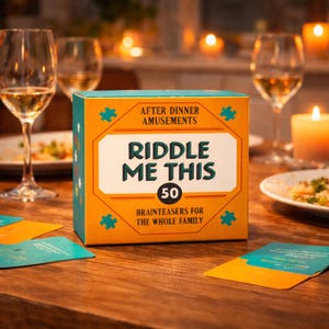 May include: A box of "Riddle Me This" game cards with the text "After Dinner Amusements" and "Brainteasers for the Whole Family". The box is orange and teal with puzzle piece designs. Wine glasses and candles are in the background.