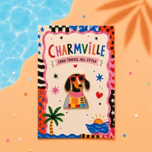 May include: A metal enamel pin of a dachshund wearing red sunglasses and a colorful patterned sweater, attached to a rectangular backing card featuring the text Charmville Zero Tricks, All Style, decorated with palm trees and sun graphics.