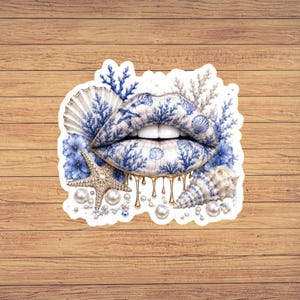 May include: A sticker featuring a pair of lips patterned with blue coral and seashell designs. The lips are surrounded by a starfish, various seashells, blue flowers, and white pearls. Gold liquid drips hang from the bottom of the lips.