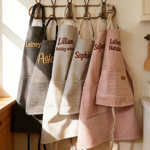 May include: A weathered wooden sign, inscribed with 'Welcome to our home' in white. The sign has a distressed appearance, ideal for a porch or hallway, creating a warm and inviting atmosphere.