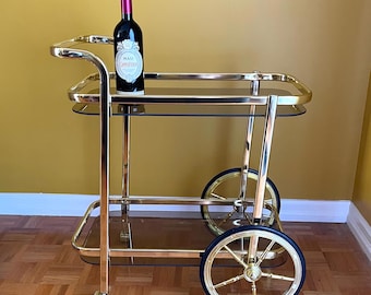 Vintage 80s Bar Cart Hollywood Regency Gold Metal and Smoked Glass Shelves Serving Trolley